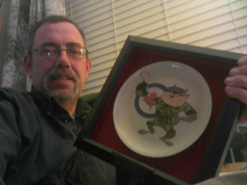 Craig Norman proudly holding his TAZ Plate