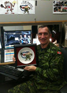 Pat Savoie, TAZ artist proudly holding the very first TAZ Plate made.