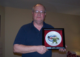 Stuart Micklethwaite proudly holding his TAZ Plate.